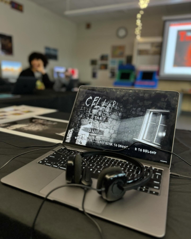 A laptop screen with a black and white image. It reads "Cellar" with "Start" underneath.