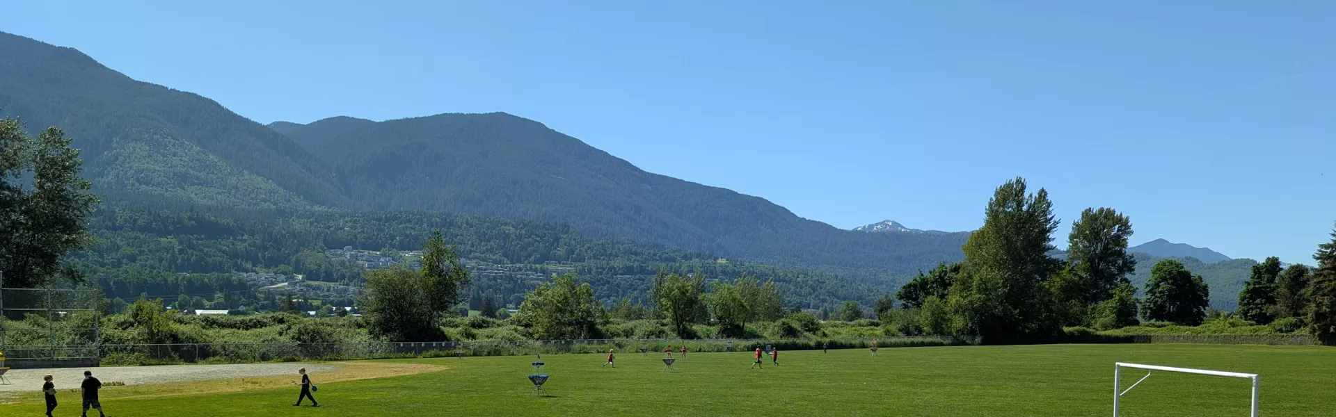 School field with mountains in background. 