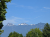 Three mountain peaks against a blue sky. 
